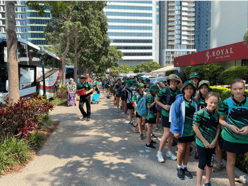 Students in front of chartered buses on a school trip
